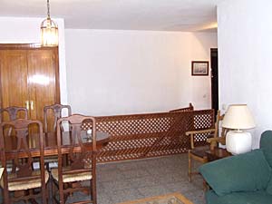 Sitting room and dining area showing stairs to lower level